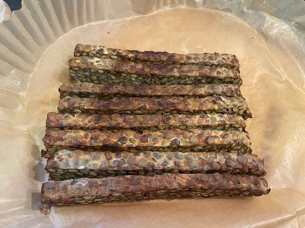 a group of sticks on a paper tray